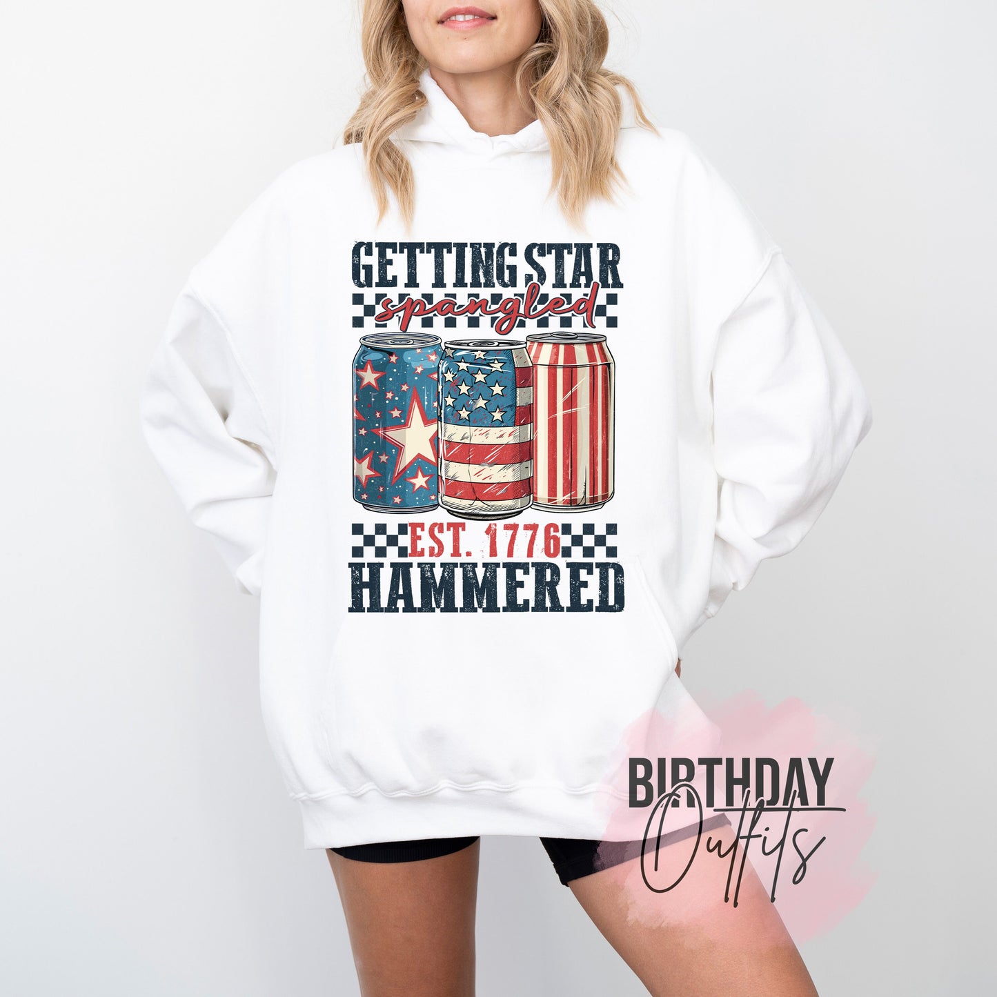 a woman wearing a white sweatshirt with an american flag on it