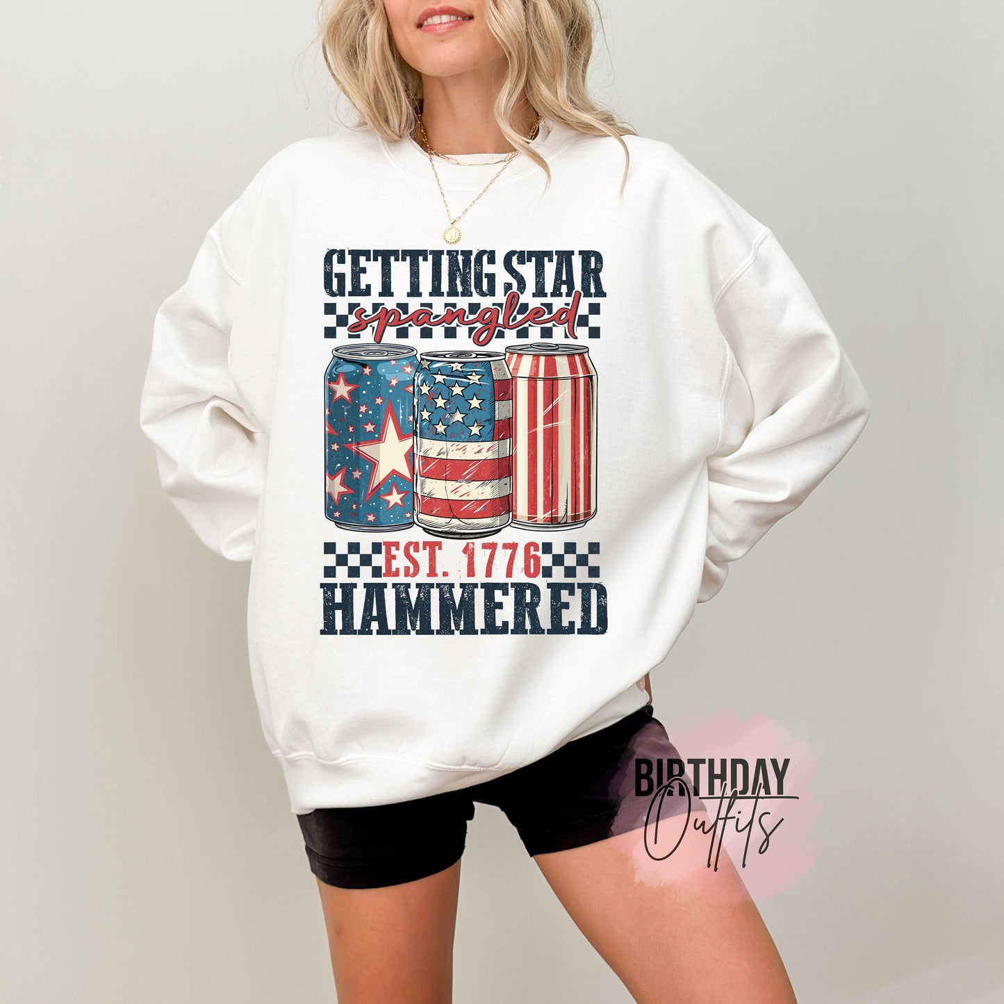 a woman wearing a white sweatshirt with an american flag on it